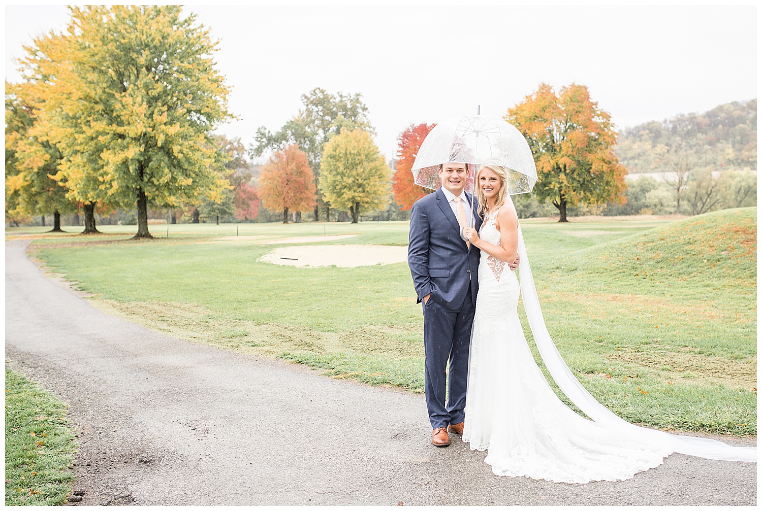 Bride and Groom with Umbrella at Twin Oaks Golf and Plantation Club