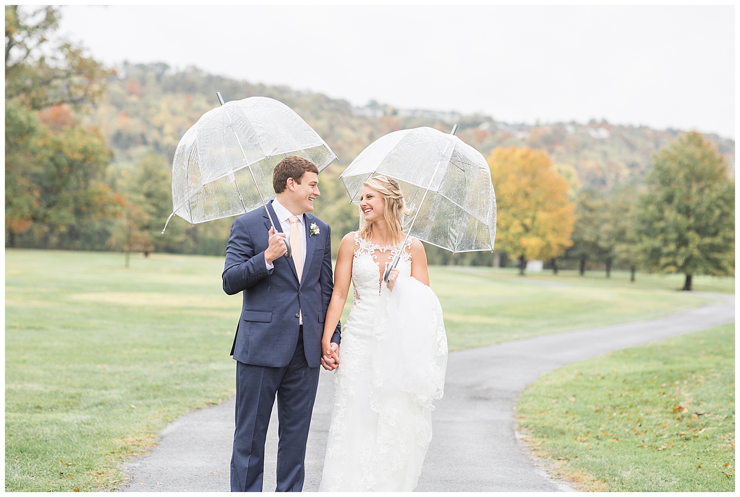 Bride and Groom Walking with Umbrellas - Cincinnati Wedding