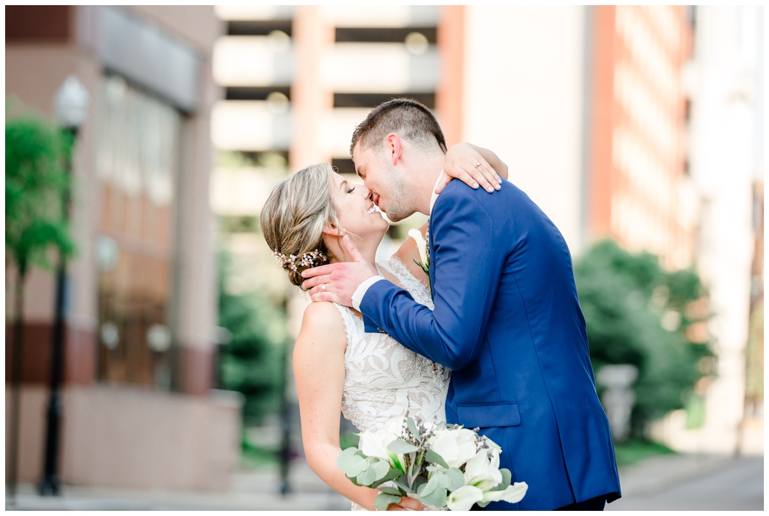 Bride and Groom Kissing in the City - Cincinnati Marriott at Rivercenter Wedding