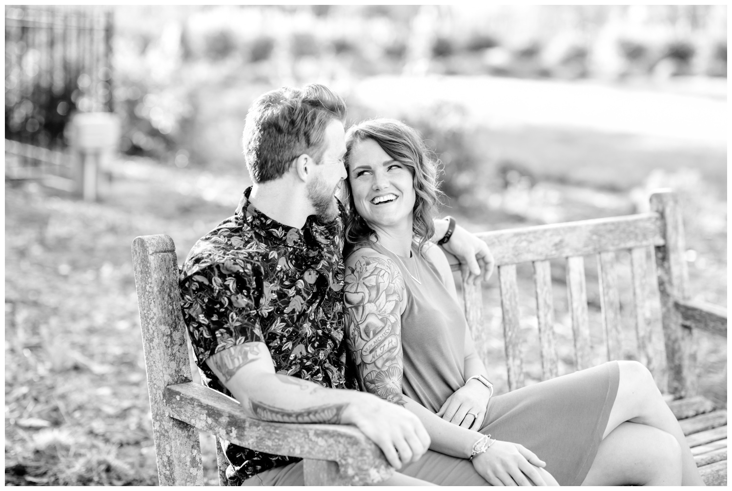 Black and White Engagement Pictures at Ault Park - Snuggling on Park Bench