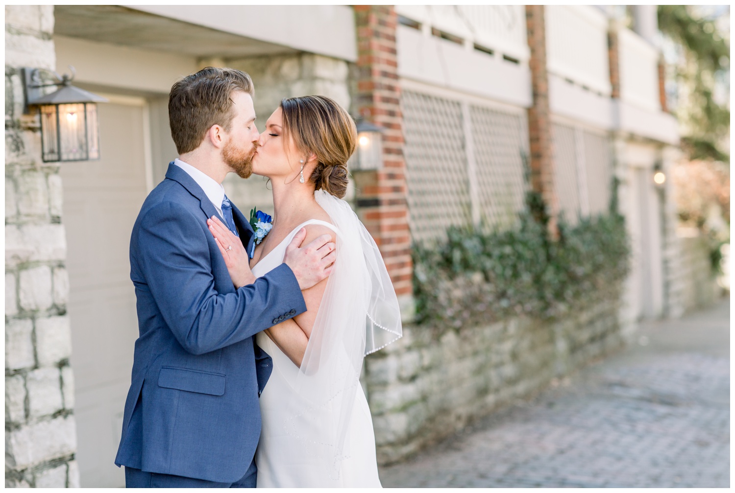 Bride and Groom Kissing Cobblestone Alley