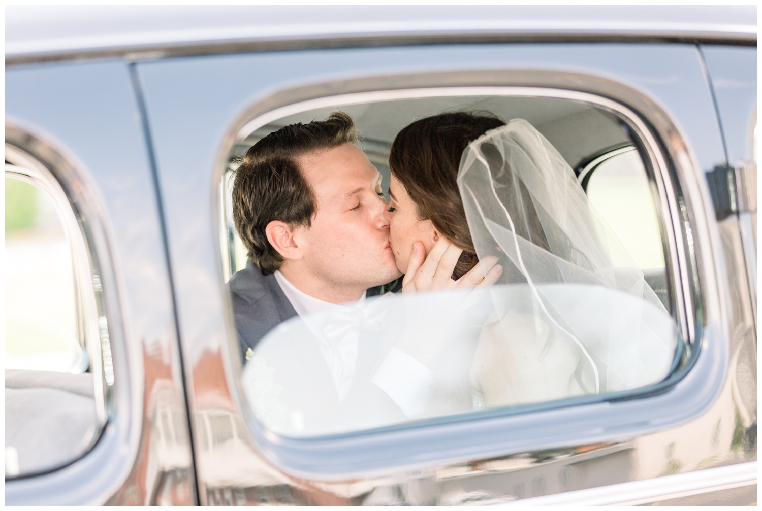 Bride and Groom Kissing in Classic Car - Cincinnati Wedding Photographer