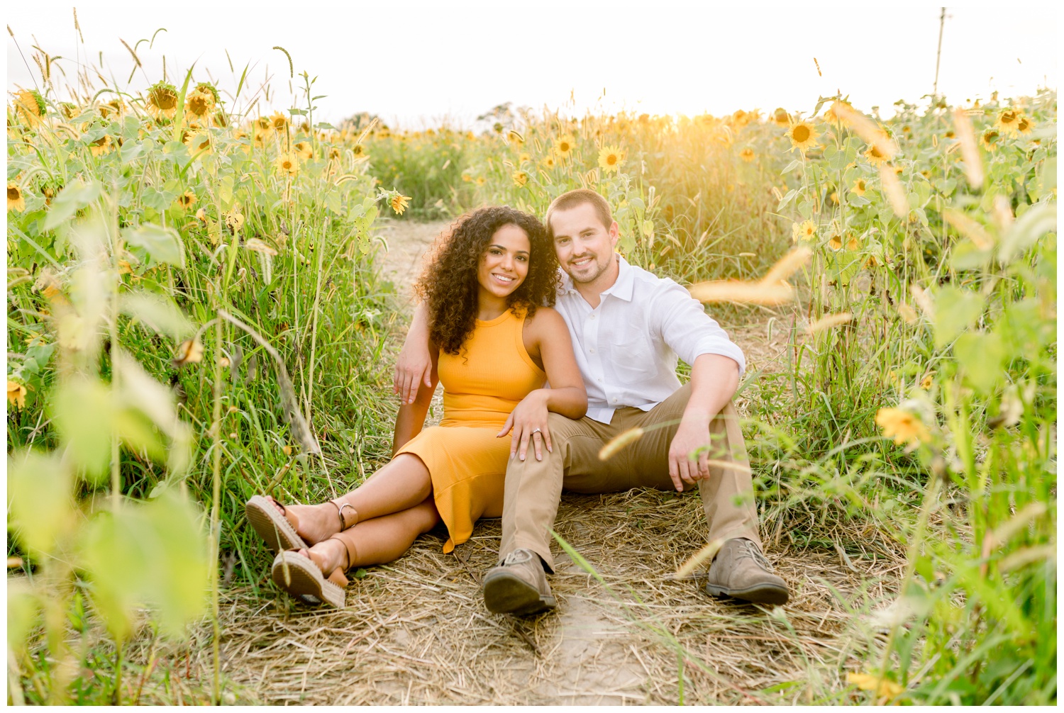 Couple Sitting in Sunflower Field at Cottell Park
