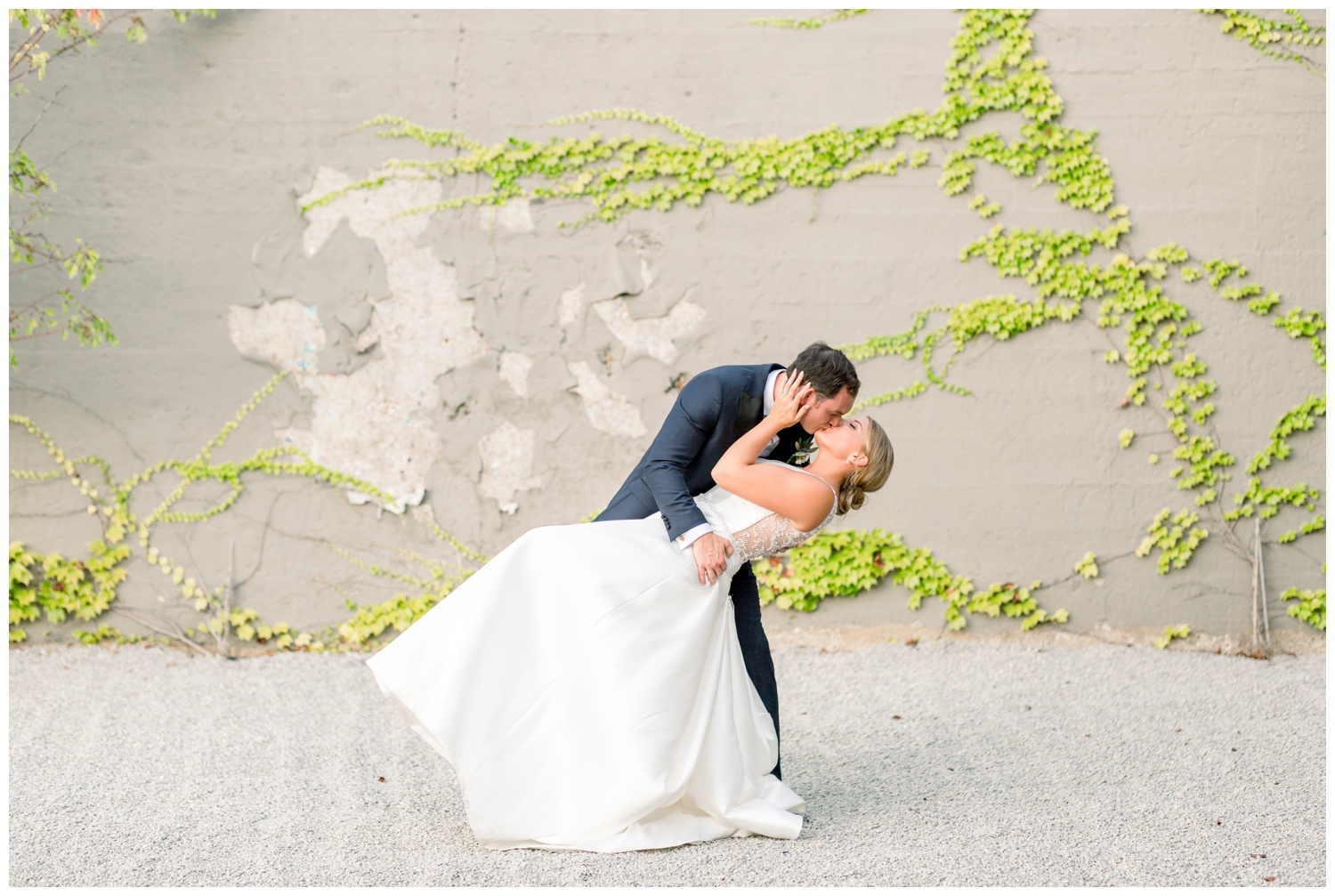 Bride and Groom Kissing in The Steam Plant Courtyard