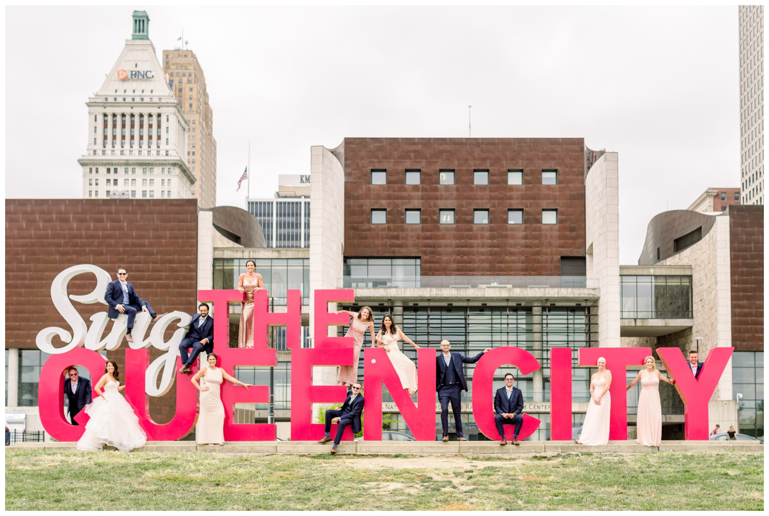 Bridal Party on Sing The Queen City Sign Downtown Cincinnati