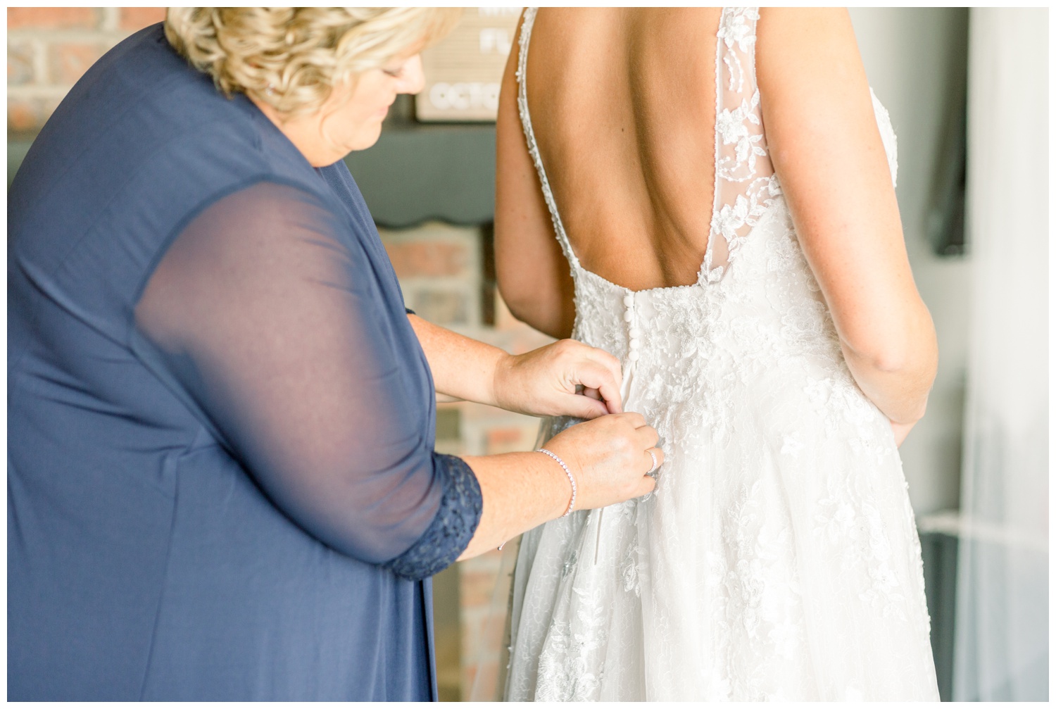 Mom Helping Bride into Wedding Dress at Northern Kentucky Wedding Venue