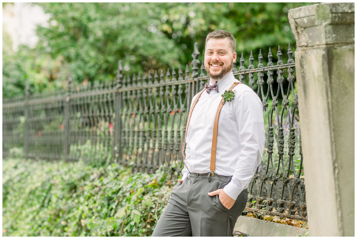 Groom in Covington by Iron Fence